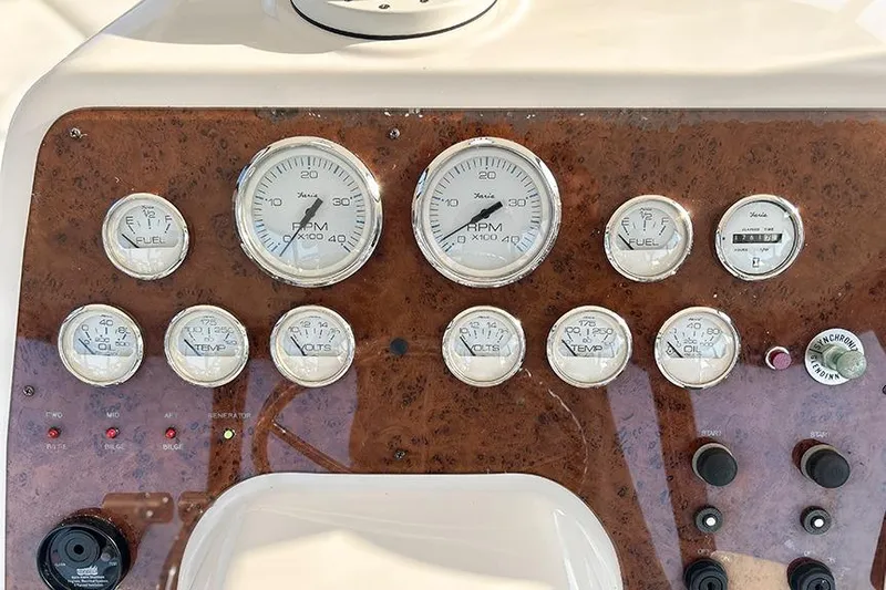  Yacht Photos Pics Dashboard of a 2002 Silverton 42 Convertible boat with various gauges and controls.