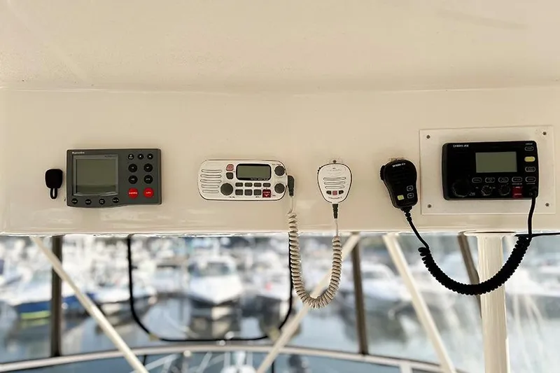  Yacht Photos Pics Control panel of a 2002 Silverton 42 Convertible yacht with communication devices.