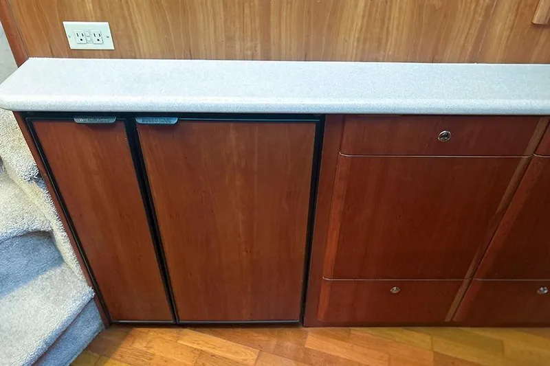  Yacht Photos Pics Wooden cabinetry and countertop inside a 2002 Silverton 42 Convertible yacht.