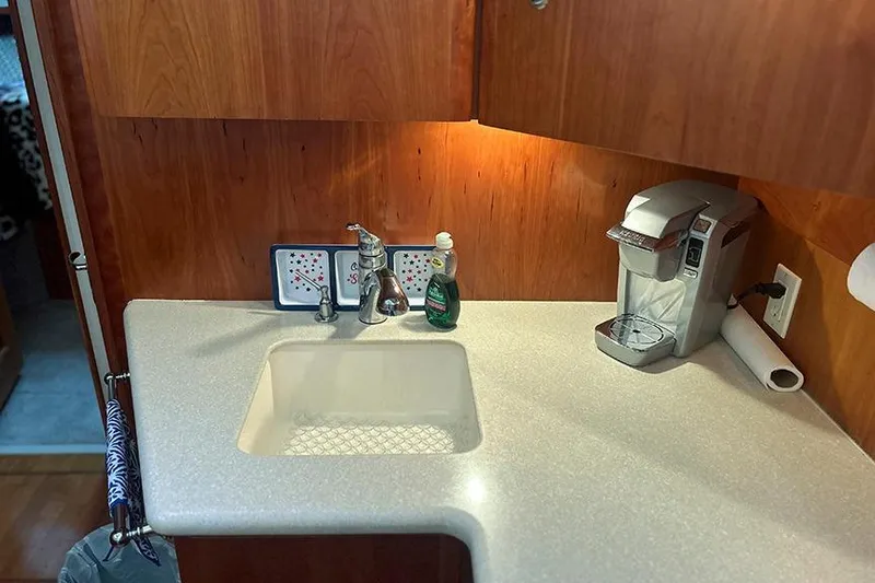  Yacht Photos Pics 2002 Silverton 42 Convertible kitchen with sink, faucet, and coffee maker.