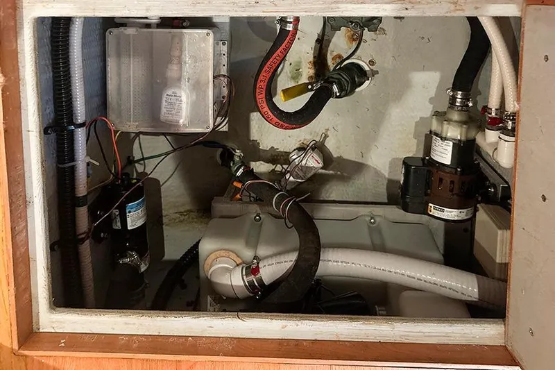  Yacht Photos Pics Engine compartment of a 2002 Silverton 42 Convertible boat, showcasing various mechanical components.