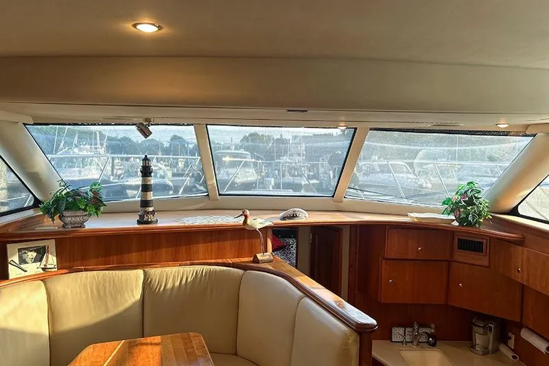  Yacht Photos Pics Interior of 2002 Silverton 42 Convertible yacht with elegant seating and decor.