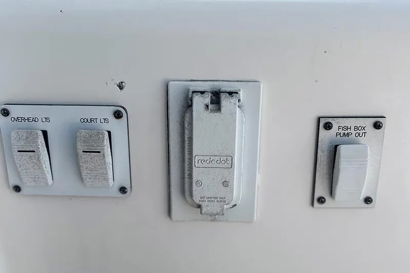  Yacht Photos Pics Control panel on a 2002 Silverton 42 Convertible boat with switches and outlets.