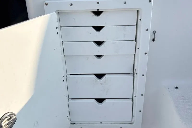  Yacht Photos Pics Storage drawers on a 2002 Silverton 42 Convertible boat, open compartment view.