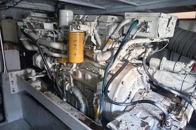  Yacht Photos Pics Engine room of a 2002 Silverton 42 Convertible yacht, showcasing complex machinery.