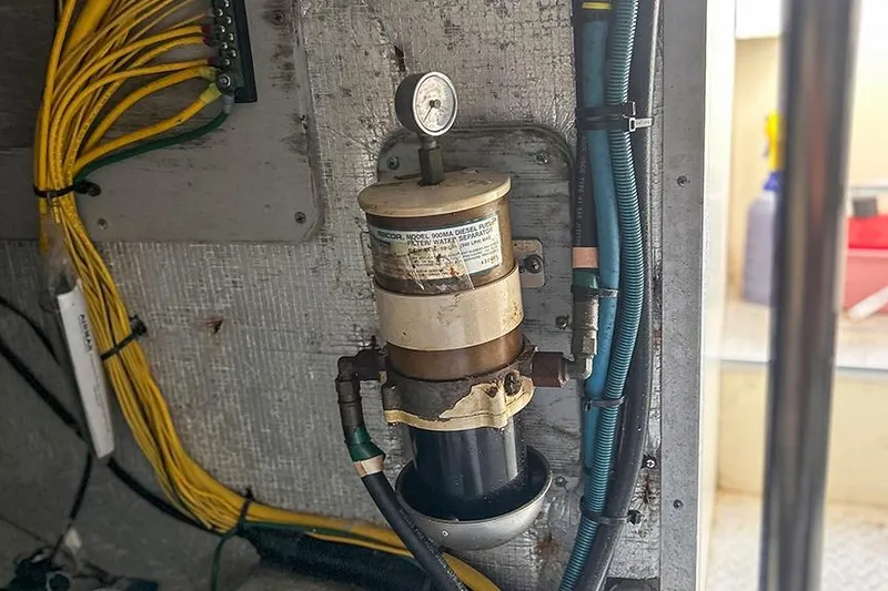  Yacht Photos Pics Fuel filter system in a 2002 Silverton 42 Convertible engine room with wiring and gauge.