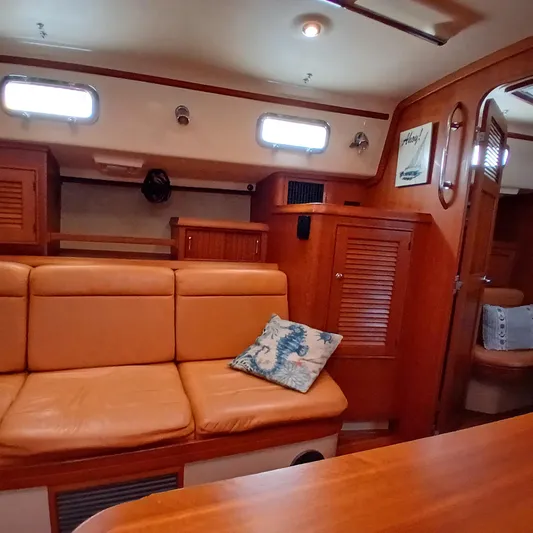 Nowhere To Be Yacht Photos Pics Interior of 2006 Island Packet 440 yacht with cozy seating and nautical decor.