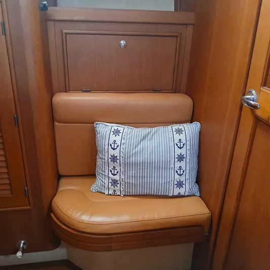 Nowhere To Be Yacht Photos Pics Cozy seating area with nautical-themed pillow on Island Packet 440, 2006 model.