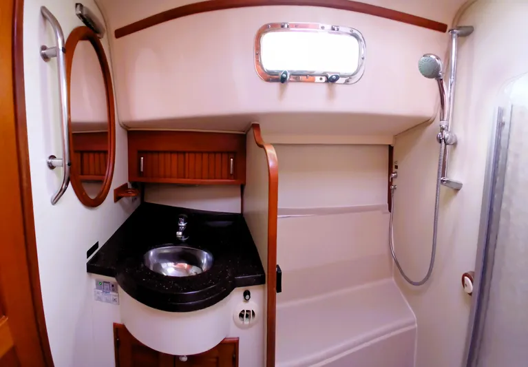 Nowhere To Be Yacht Photos Pics Bathroom interior of 2006 Island Packet 440 yacht with sink and shower.