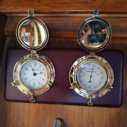 Nowhere To Be Yacht Photos Pics Brass nautical clock and barometer on 2006 Island Packet 440 yacht.