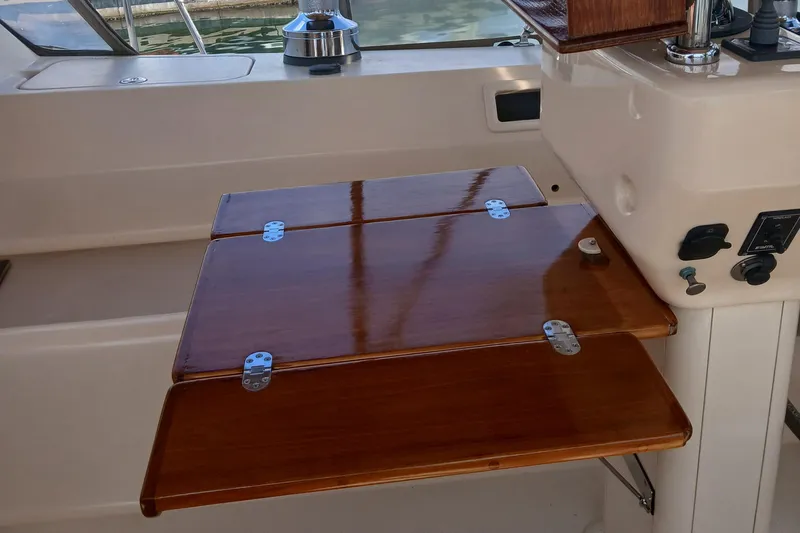 Nowhere To Be Yacht Photos Pics Foldable wooden table on 2006 Island Packet 440 yacht deck.