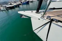 2023 Solaris 50 yacht docked in marina, showcasing sleek bow design.