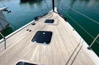 Deck view of 2023 Solaris 50 yacht in marina, surrounded by boats.