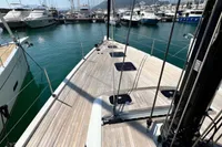 Deck view of a 2023 Solaris 50 yacht docked in a marina.