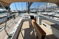 Luxurious 2023 Solaris 50 yacht interior with spacious deck and marina view.