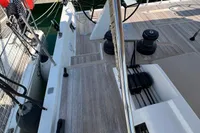 2023 Solaris 50 yacht deck with steering wheel and winches at marina.