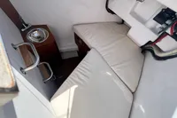 Interior of 2023 Solaris 50 yacht with compact sink and cushioned seating area.
