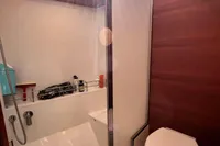 Modern bathroom in 2023 Solaris 50 yacht with shower and toilet.