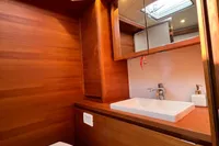 Luxurious wooden bathroom interior of 2023 Solaris 50 yacht with modern fixtures.