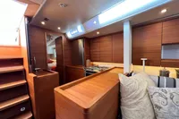 Luxurious interior of 2023 Solaris 50 yacht with modern kitchen and cozy seating area.