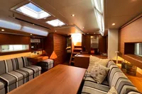 Luxurious interior of 2023 Solaris 50 yacht with modern furnishings and ample natural light.