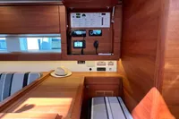 Interior of 2023 Solaris 50 yacht with control panel and wooden furnishings.