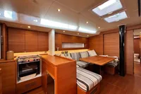 Luxurious interior of 2023 Solaris 50 yacht with wood finish and skylights.