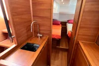 Luxurious interior of 2023 Solaris 50 yacht with wooden finish and cozy cabin.