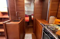 Luxurious interior of 2023 Solaris 50 yacht with wood finish and modern amenities.