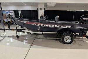 2026 Tracker Super Guide V-16 SC fishing boat on display indoors.