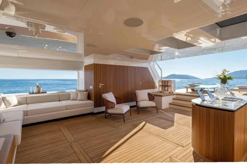 Oceano 44 Yacht Photos Pics Luxurious interior of 2027 Mangusta Oceano 44 yacht with ocean view and elegant seating.