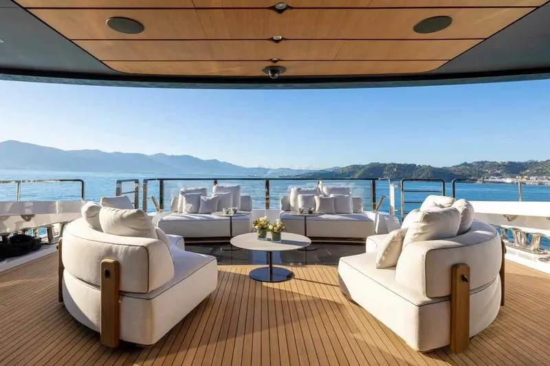 Oceano 44 Yacht Photos Pics Luxurious deck of 2027 Mangusta Oceano 44 yacht with elegant seating and ocean view.