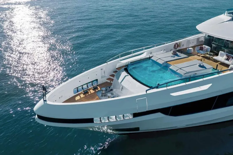 Oceano 44 Yacht Photos Pics Luxurious 2027 Mangusta Oceano 44 yacht with pool, cruising on serene blue waters.