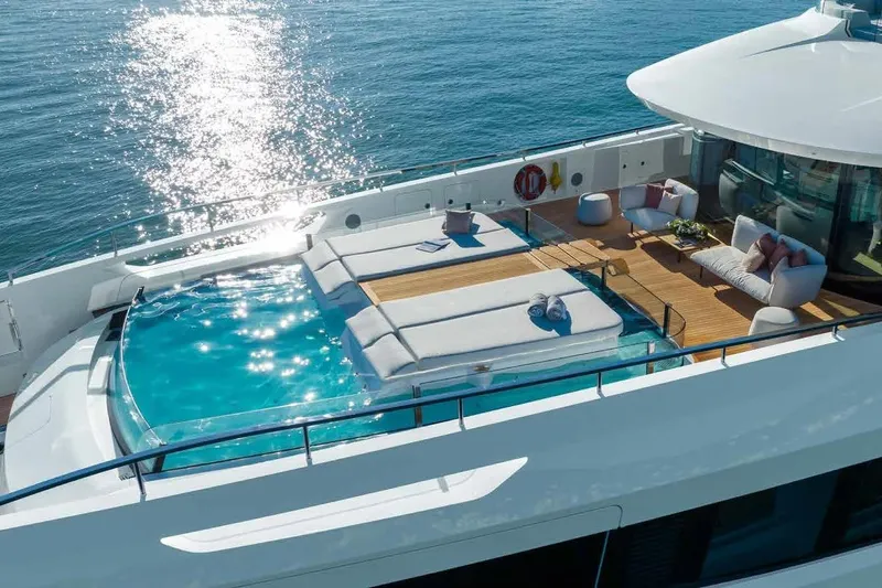 Oceano 44 Yacht Photos Pics Luxurious Mangusta Oceano 44 yacht deck with pool and seating, 2027 model.