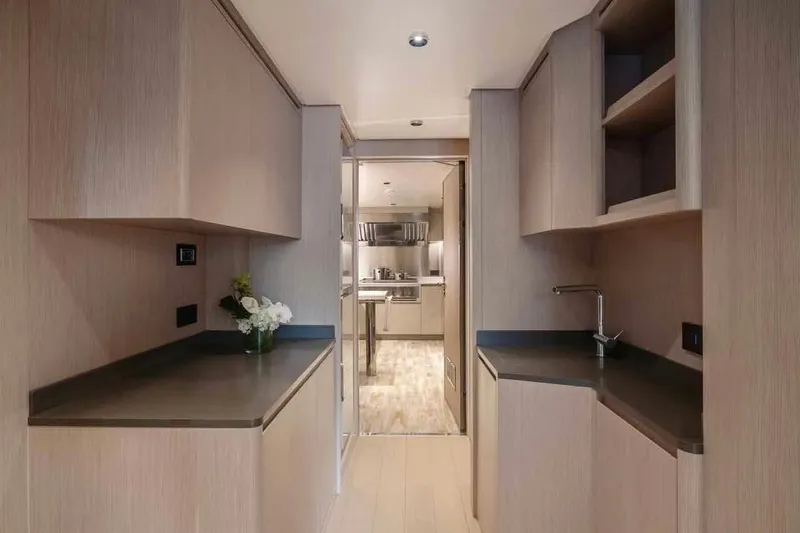 Oceano 44 Yacht Photos Pics Modern kitchen interior of 2027 Mangusta Oceano 44 yacht, featuring sleek cabinetry and countertops.