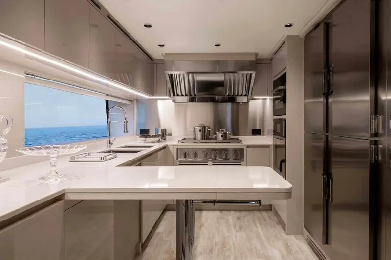 Oceano 44 Yacht Photos Pics Luxurious kitchen interior of 2027 Mangusta Oceano 44 yacht with ocean view.
