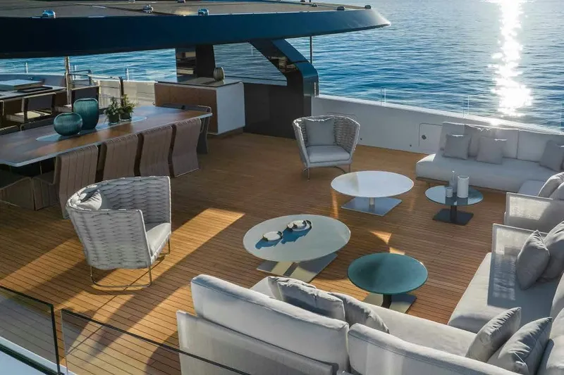 Oceano 44 Yacht Photos Pics Luxurious deck of 2027 Mangusta Oceano 44 yacht with elegant seating and ocean view.