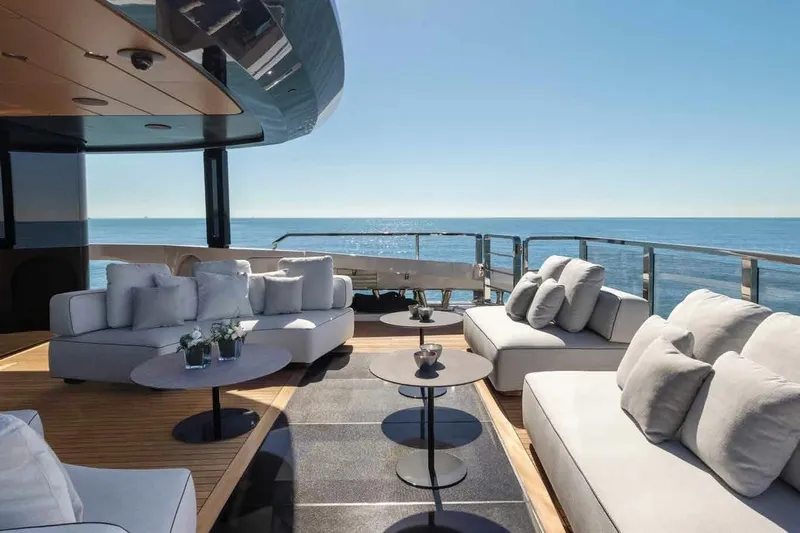 Oceano 44 Yacht Photos Pics Luxurious deck of 2027 Mangusta Oceano 44 yacht with elegant seating and ocean view.
