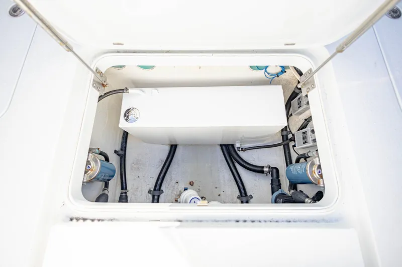 Done Deal Yacht Photos Pics 2015 Yellowfin 32 Offshore boat compartment with visible wiring and components.