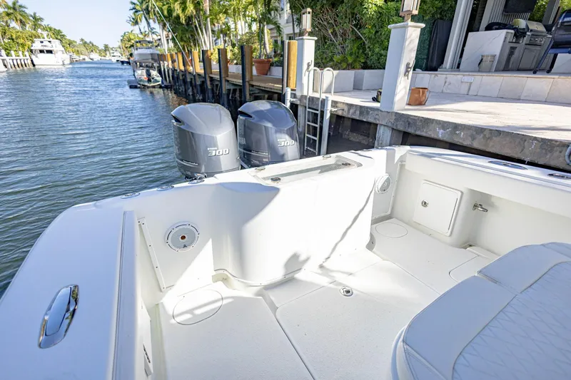 Done Deal Yacht Photos Pics 2015 Yellowfin 32 Offshore boat with dual Yamaha 300 engines docked by waterfront.