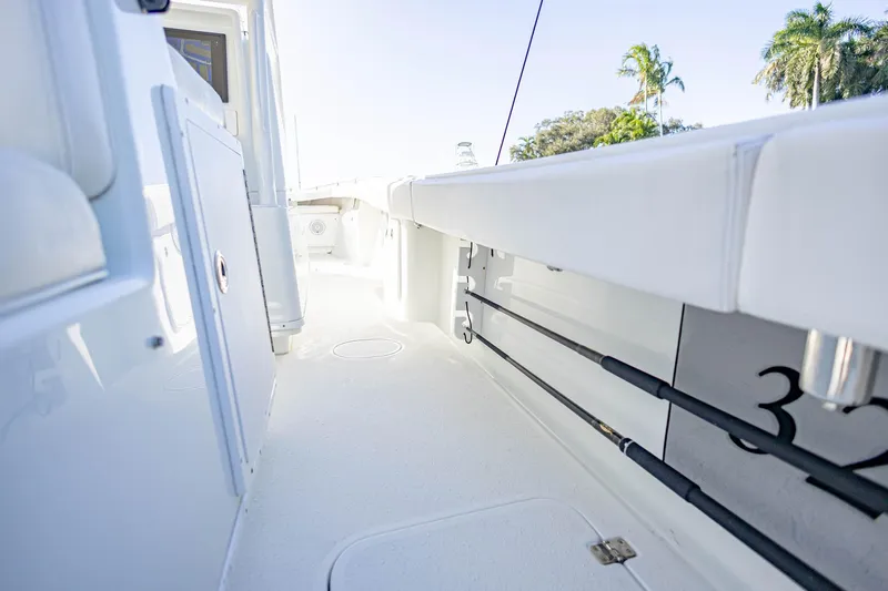 Done Deal Yacht Photos Pics 2015 Yellowfin 32 Offshore boat interior with fishing rod holders and sleek design.