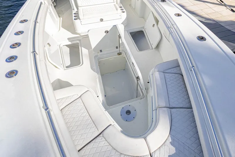 Done Deal Yacht Photos Pics 2015 Yellowfin 32 Offshore boat interior with open storage compartments and seating.