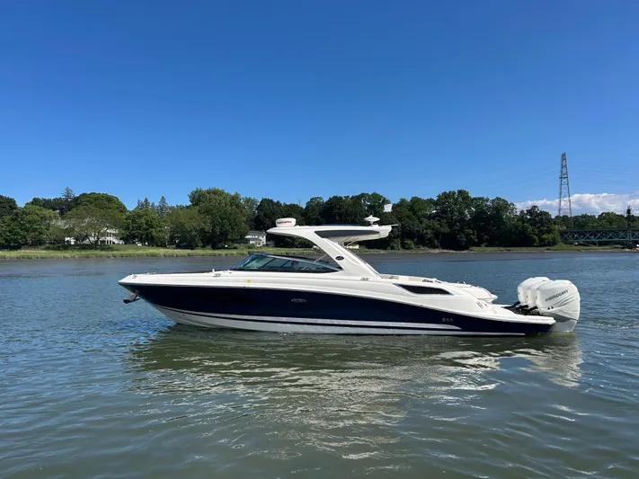  Yacht Photos Pics 2017 Sea Ray SLX 350 Outboard boat on calm water under clear blue sky.