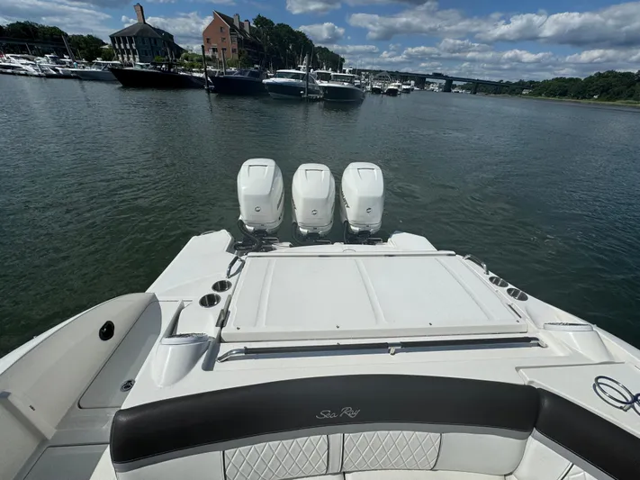  Yacht Photos Pics 2017 Sea Ray SLX 350 Outboard boat with triple engines, docked in a marina.
