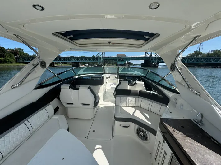  Yacht Photos Pics 2017 Sea Ray SLX 350 Outboard interior with luxurious seating and scenic waterway view.