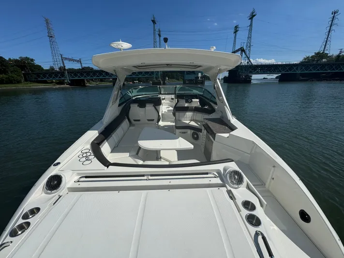  Yacht Photos Pics 2017 Sea Ray SLX 350 Outboard boat on water near a bridge, sunny day.