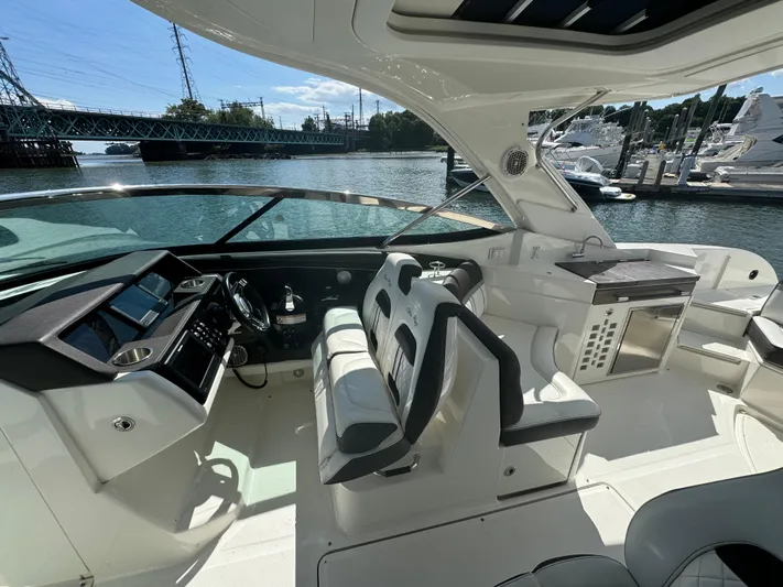  Yacht Photos Pics 2017 Sea Ray SLX 350 Outboard interior with helm, seating, and water view.