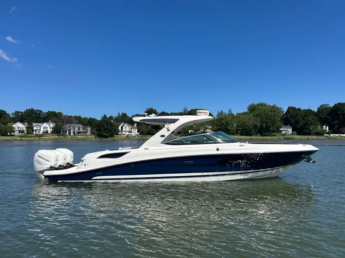  Yacht Photos Pics 2017 Sea Ray SLX 350 Outboard boat on calm water, with scenic shoreline background.