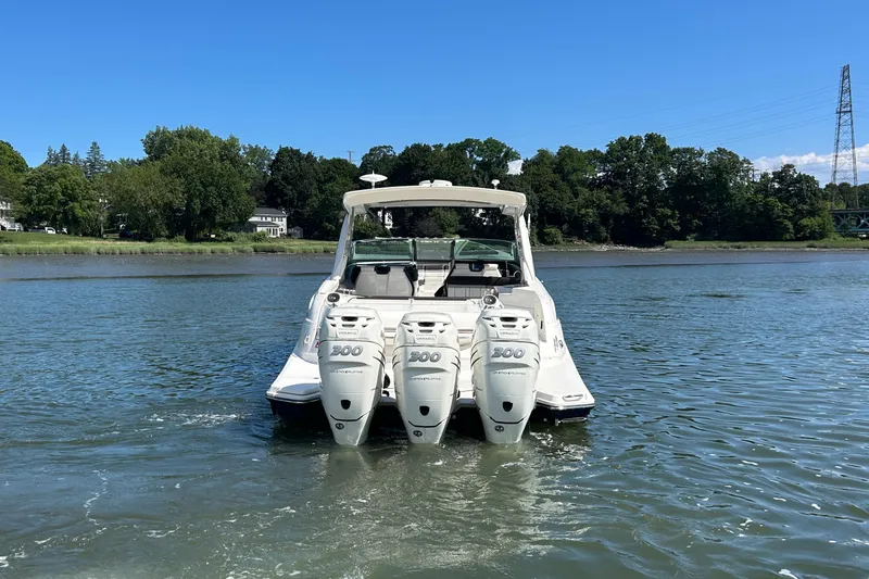  Yacht Photos Pics 2017 Sea Ray SLX 350 Outboard boat with triple engines on a calm lake.