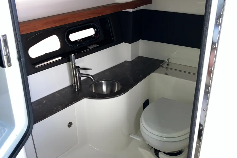  Yacht Photos Pics 2017 Sea Ray SLX 350 Outboard boat bathroom with sink and toilet.